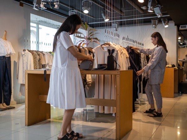 Finished apparel merchandised on rails in a retail store
