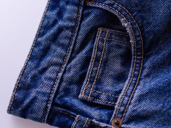 Stack of finished denim jeans after washing