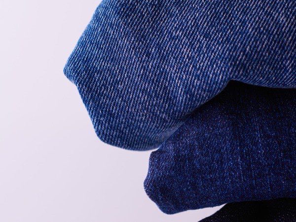 Close-up of denim stitching and hardware after washing