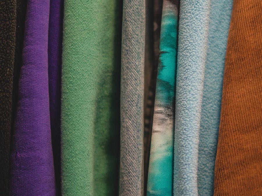 Folded fabric in a range of colours ready for cutting