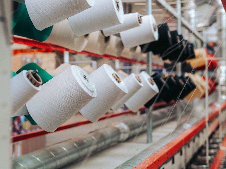 Yarn cones running on textile mill machinery