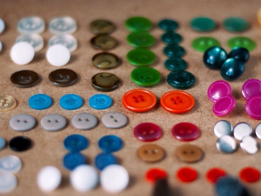 Buttons and garment trims laid out for approval