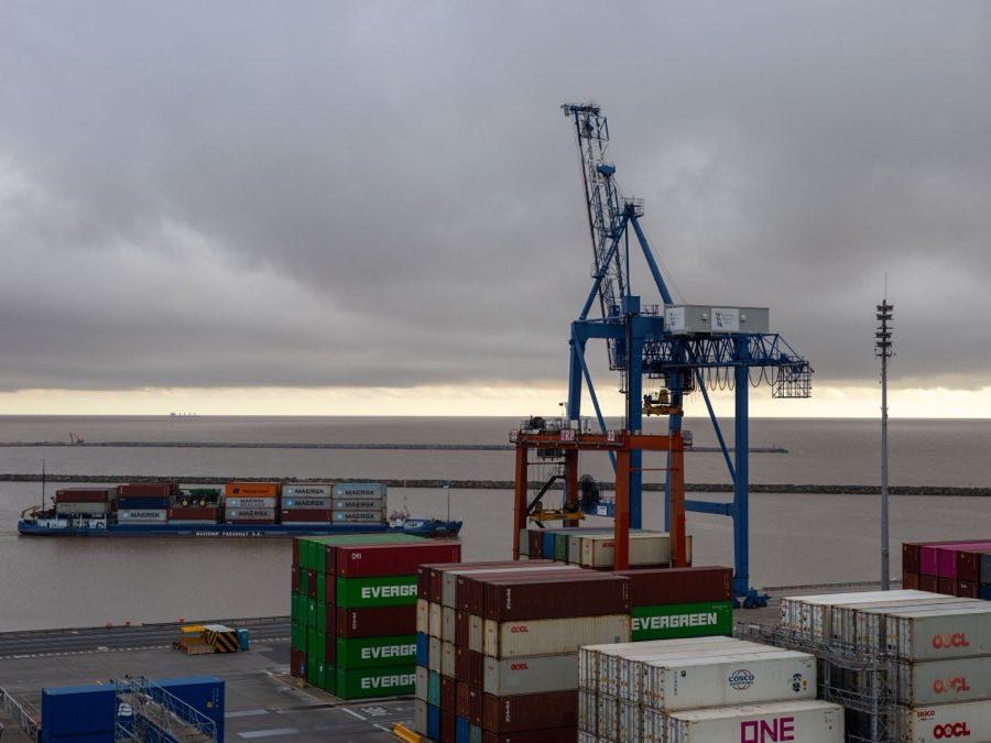 Container cranes and stacked containers at an export port