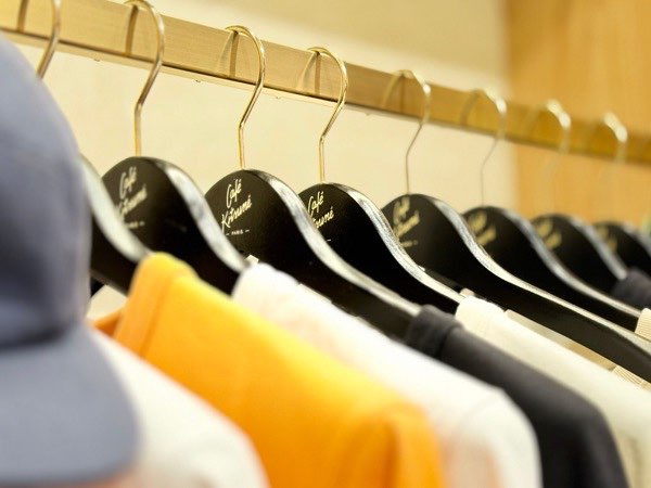 Finished garments in a range of colours on a rail