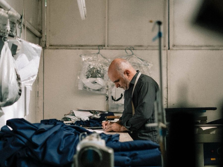 Garment technician working at an industrial sewing machine