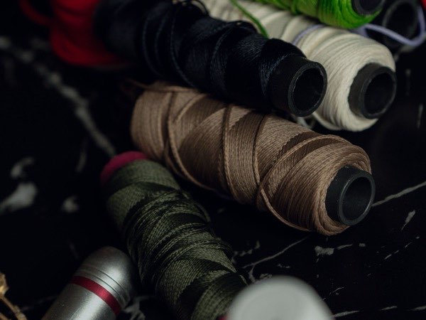 Spools of sewing thread arranged for production